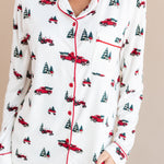 top part of a woman with her hand in her pant pocket wearing long sleeve pajama set in holiday tree farm
---PJ 2