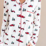 top part of a woman with her hand in her pant pocket wearing long sleeve pajama set in holiday tree farm
---PJ 2