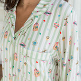 Pocket shirt of Long-Sleeved Women's Pajama Set having colorful Harry Potter patterns on a green and white striped fabric.
