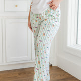 Close up of a model standing on a hardwood floor while wearing the  Women's Lounge Pants in Honeydukes