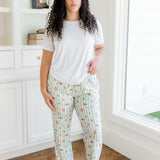 Model standing in a white walled  room and window while wearing the Women's Lounge Pants in Honey dukes paired with a Crew Neck in Cloud 
::: Model is 5'9" wearing size L ///

