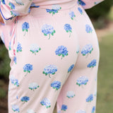 The back of a woman with her hands in her pajama pants in Hydrangea Sakura print. ---1605 1
