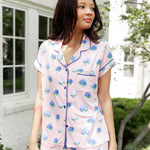 Woman outside looking over her shoulder in short sleeve and short pajamas in Hydrangea Sakura print. ---1615 3