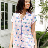 Woman outside looking over her shoulder in short sleeve and short pajamas in Hydrangea Sakura print. ---1615 3