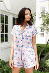 Woman outside looking over her shoulder in short sleeve and short pajamas in Hydrangea Sakura print. ::: Model is 5'10" wearing size S ///
 ---1615 3