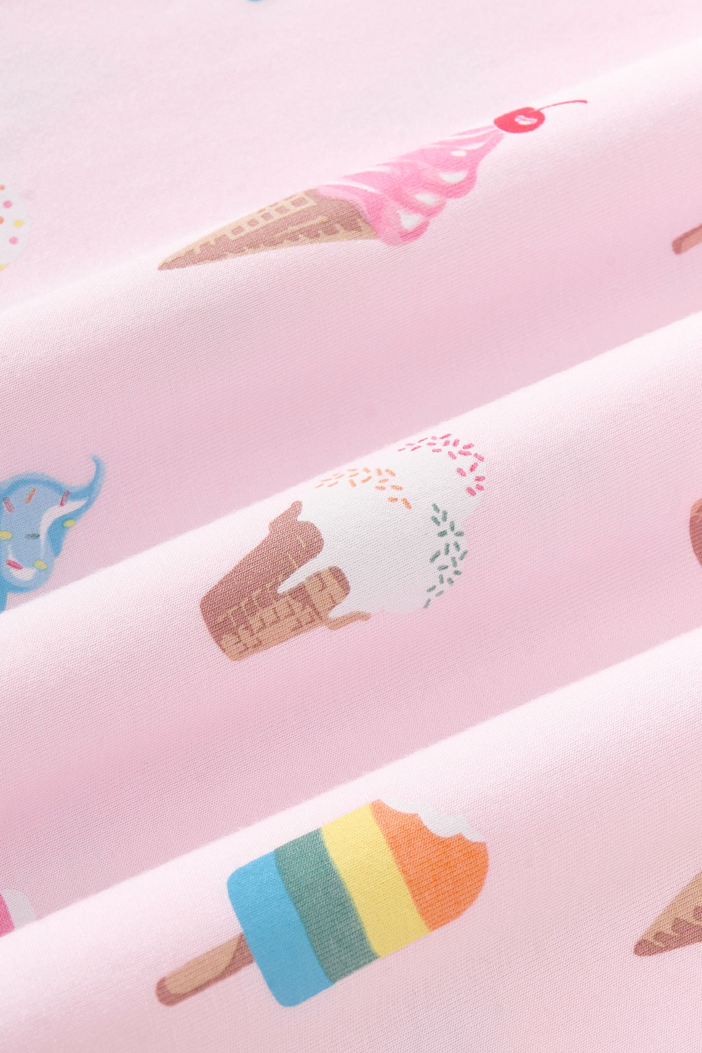 Close up of fabric of the Ice Cream print on Sakura Ice background 