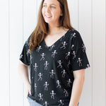 Woman modeling the Kyte Women's V-Neck in Skeleton with hand on her hip