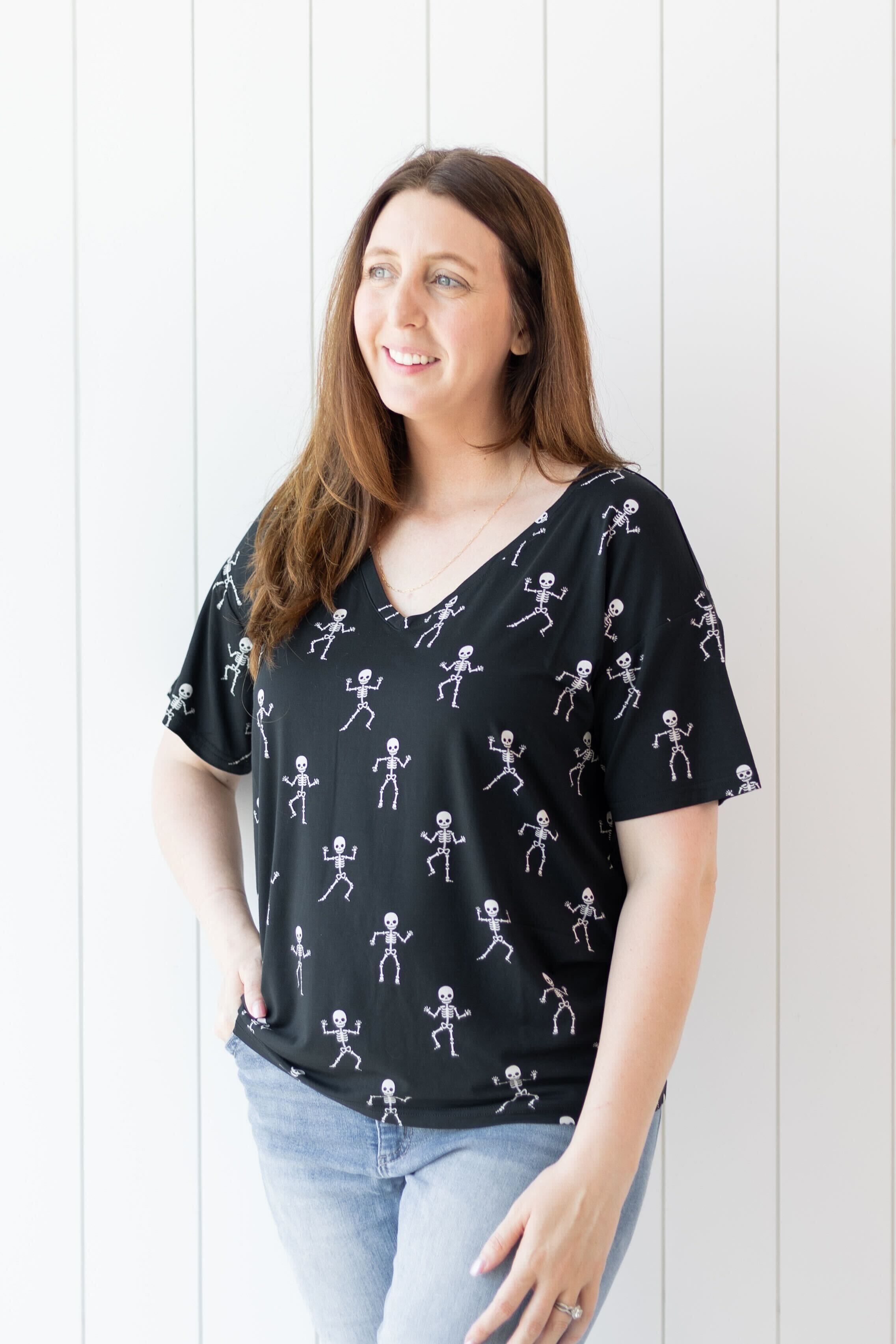 Woman modeling the Kyte Women's V-Neck in Skeleton with hand on her hip