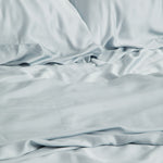 Close up of the Bamboo Sateen Sheet Set in Ice shown on a bed