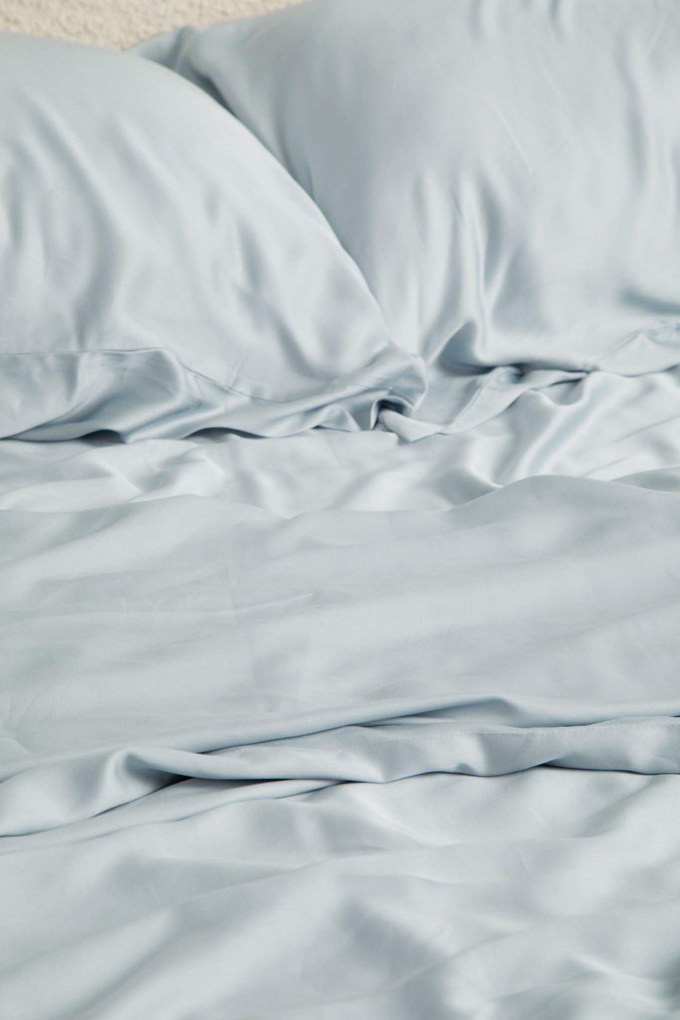 Close up of the Bamboo Sateen Sheet Set in Ice shown on a bed
