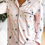 Person wearing a pink pajama set with sushi pattern
---PJ 2