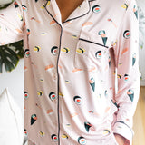 Person wearing a pink pajama set with sushi pattern
---PJ 2