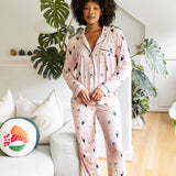 Woman wearing a pink pajama set with a sushi pattern in a living room. ::: Model is 5'9"" wearing size S ///
---1605 3