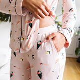 Person wearing a sushi-themed pajama set in a casual setting. ---1605 1