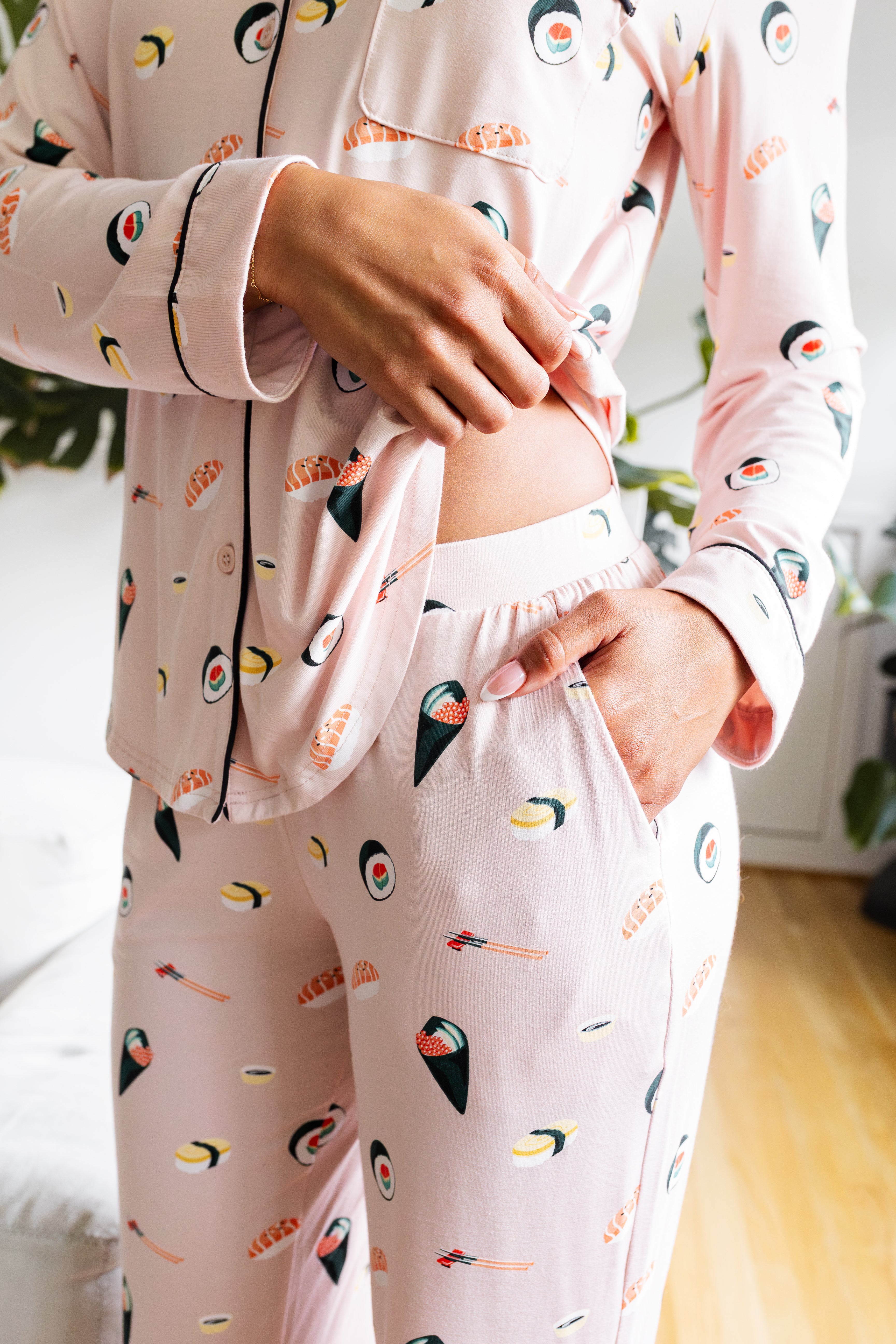 Person wearing a sushi-themed pajama set in a casual setting. ---1605 1