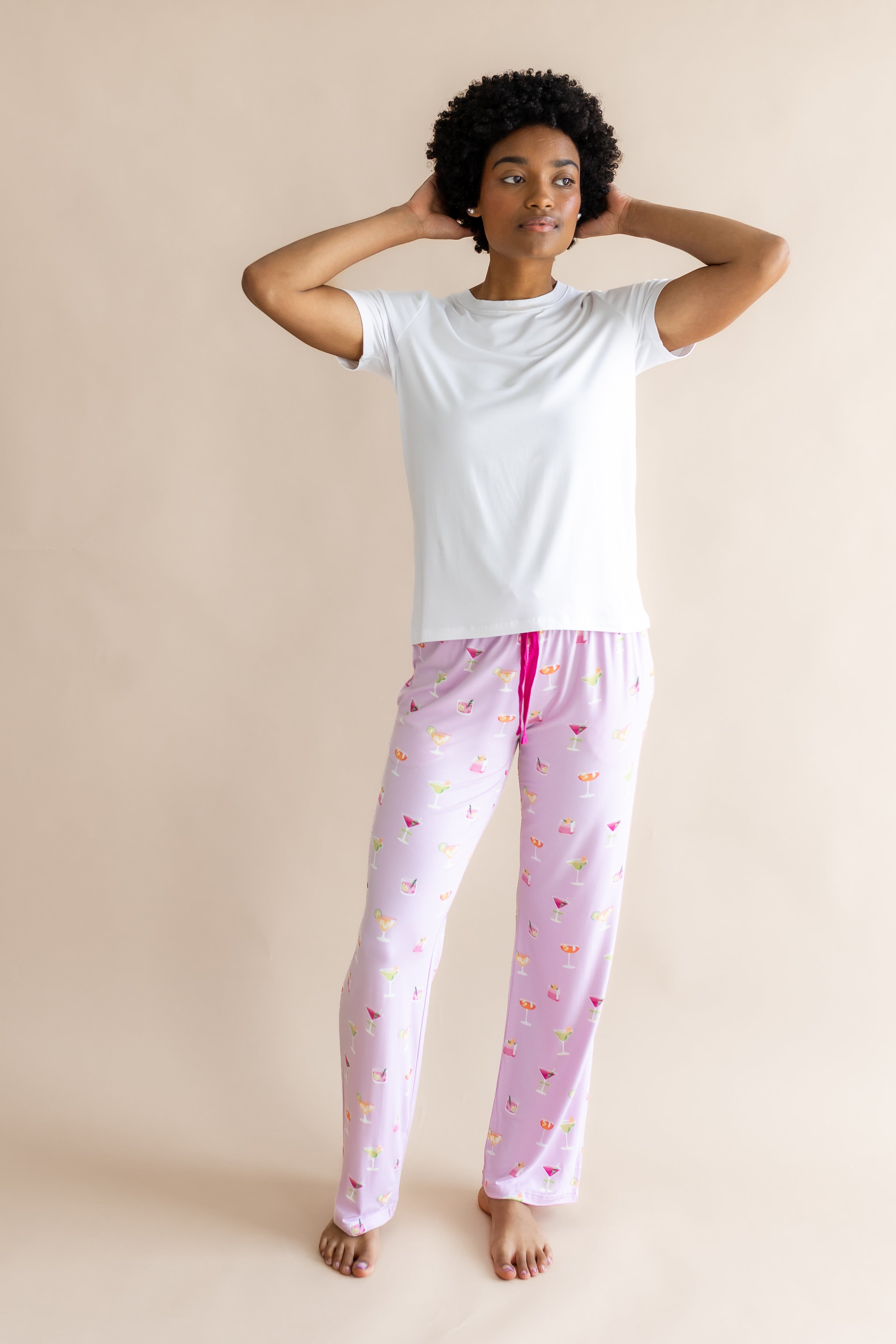 Model with hands on her head while wearing the Women's Lounge Pants in Cocktail