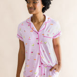 Smiling model looking to the side and close up of the top from the Women's Short Sleeve Cropped Pajama Set in Cocktail