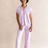 Model standing in front of a beige back ground while wearing the Women's Short Sleeve Cropped Pajama Set in Cocktail
::: Model is 5'9" wearing size S ///