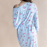 Light blue dress with mahjong patterns on a beige background