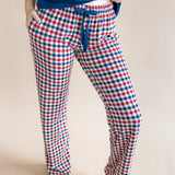 Close  up of model wearing the Women's Lounge Pants in Patriotic Gingham while on a model standing in front of a beige background

::: Model is 5'7" wearing size S ///
