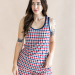 Model standing in front of a beige back ground while looking to the side and wearing the Kyte Women's Tank Set in Patriotic Gingham

::: Model is 5'7" wearing size S ///