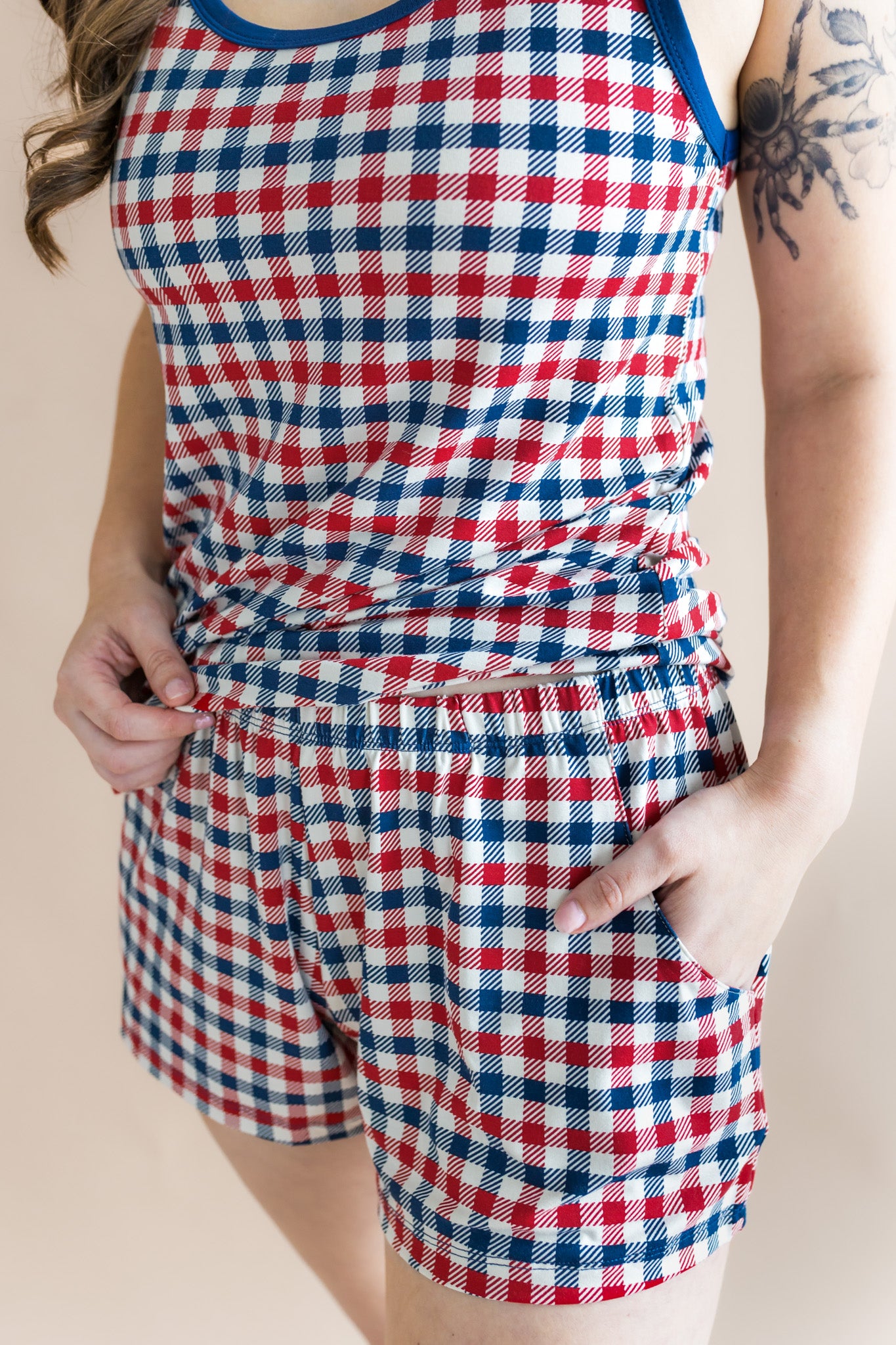 Close up of the Women's Tank Set in Patriotic Gingham with hand in her pocket 