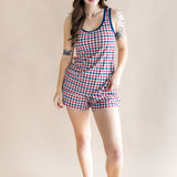 Full body of model wearing the Women's Tank Set in Patriotic Gingham with one hand on hip with a beige back ground 