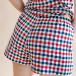 Close up of the back side of the bottoms from the Women's Tank Set in Patriotic Gingham on  a model 
