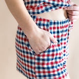 Close up of the bottoms from the Women's Tank Set in Patriotic Gingham with the model's hand in pocket showcasing the waistband