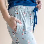 Close up of the model's hand in the pocket  of the Women's Lounge Pants in Patriotic Goose