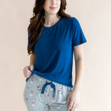 Woman looking to the side while modeling the Women's Lounge Pants in Patriotic Goose with hand on her hip 