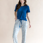 Smiling model wearing the Women's Lounge Pant in Patriotic Goose paired with Crew Neck in Tahoe while standing in front of a beige back ground 
::: Model is 5'7" wearing size S ///