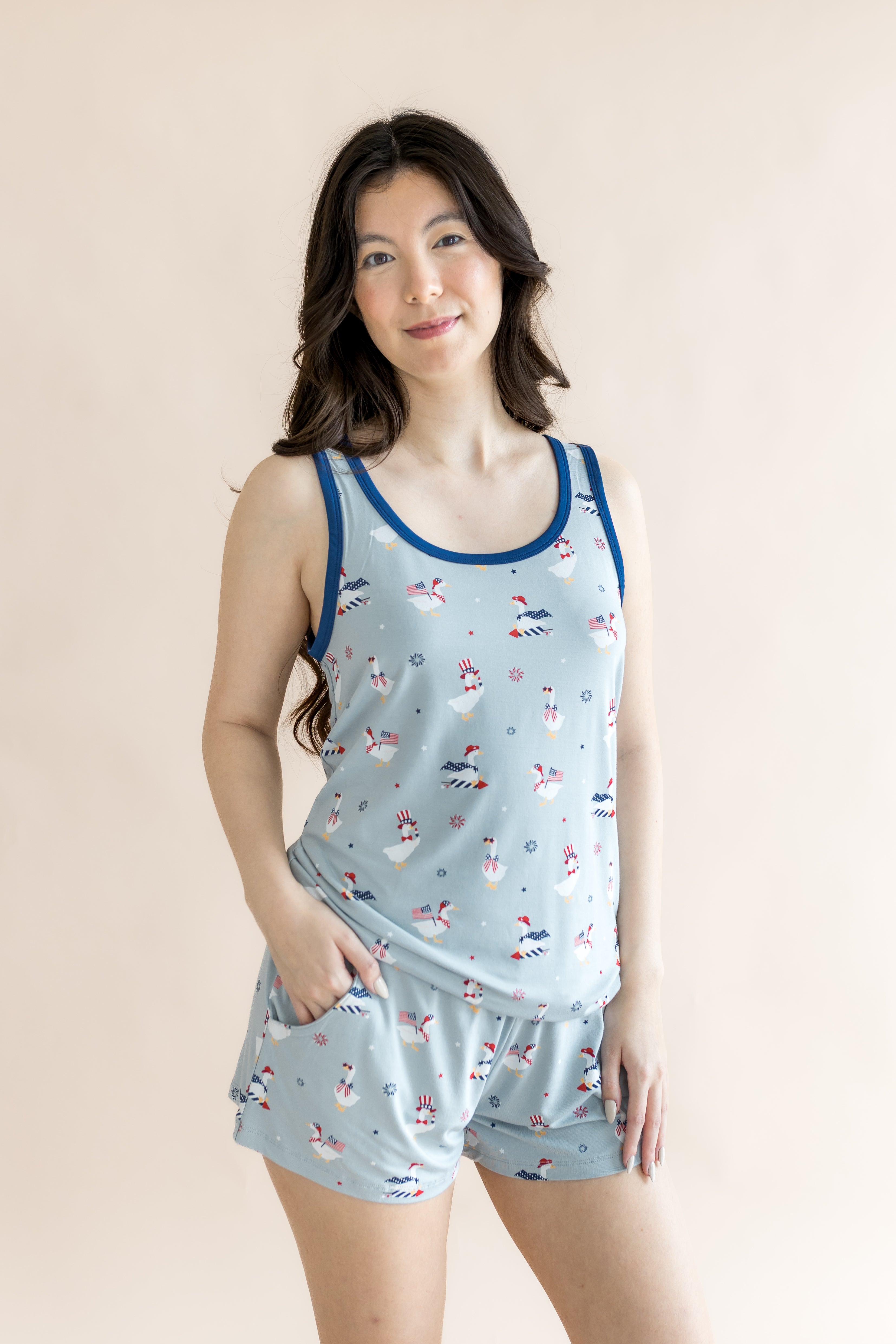 Model smiling with hand in pocket while modeling the Women's Tank Set in Patriotic Goose

::: Model is 5'6" wearing size S ///