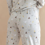 Back side of a person wearing a pajama of Long-Sleeved Women's Pajama Set with Harry Potter prints on a beige background.