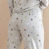 Back side of a person wearing a pajama of Long-Sleeved Women's Pajama Set with Harry Potter prints on a beige background.
