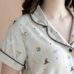 Close up of the top from the Women's Short Sleeve Pajama Set in Starry Icon while on a model 