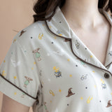 Close up of the top from the Women's Short Sleeve Pajama Set in Starry Icon while on a model 