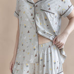 Model showcasing the waist band on the shorts from the Women's Short Sleeve Pajama Set in Starry Icon