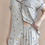Model showcasing the waist band on the shorts from the Women's Short Sleeve Pajama Set in Starry Icon