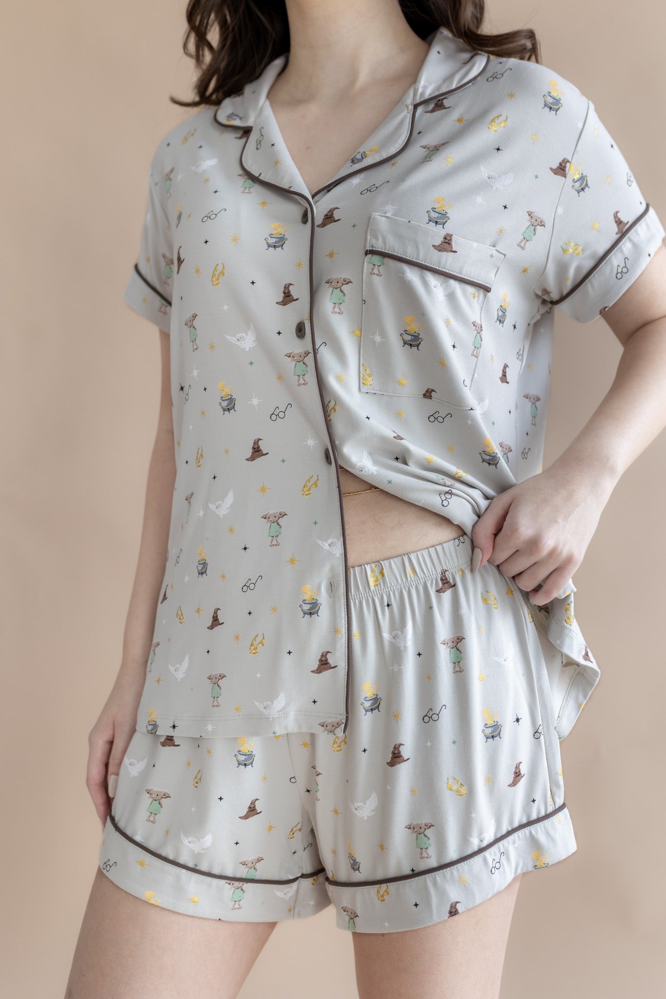 Model showcasing the waist band on the shorts from the Women's Short Sleeve Pajama Set in Starry Icon