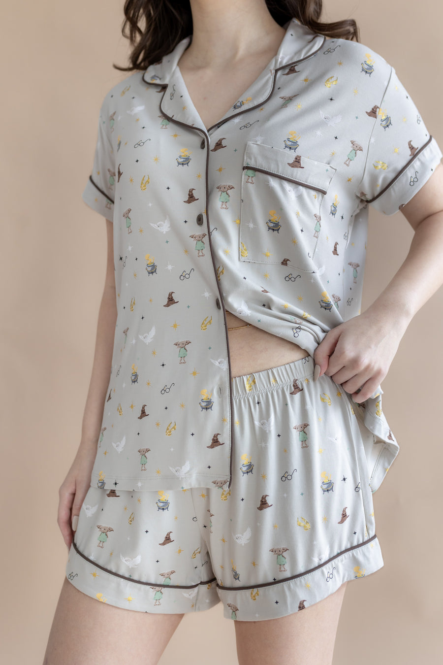 Model showcasing the waist band on the shorts from the Women's Short Sleeve Pajama Set in Starry Icon