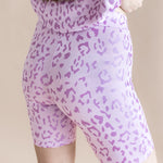 Back side of Women’s Biker Short Set shorts in Thistle Leopard print on a beige background