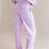 Back side of Women's Long Sleeve Pajama Set in Thistle Leopard print on a beige background