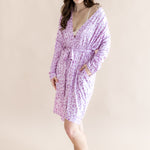Model posing in Women's lounge robe in Thistle Leopard print on a beige background