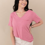 Woman modeling Women’s Relaxed Fit V-Neck in Apple Blossom with hand on hip