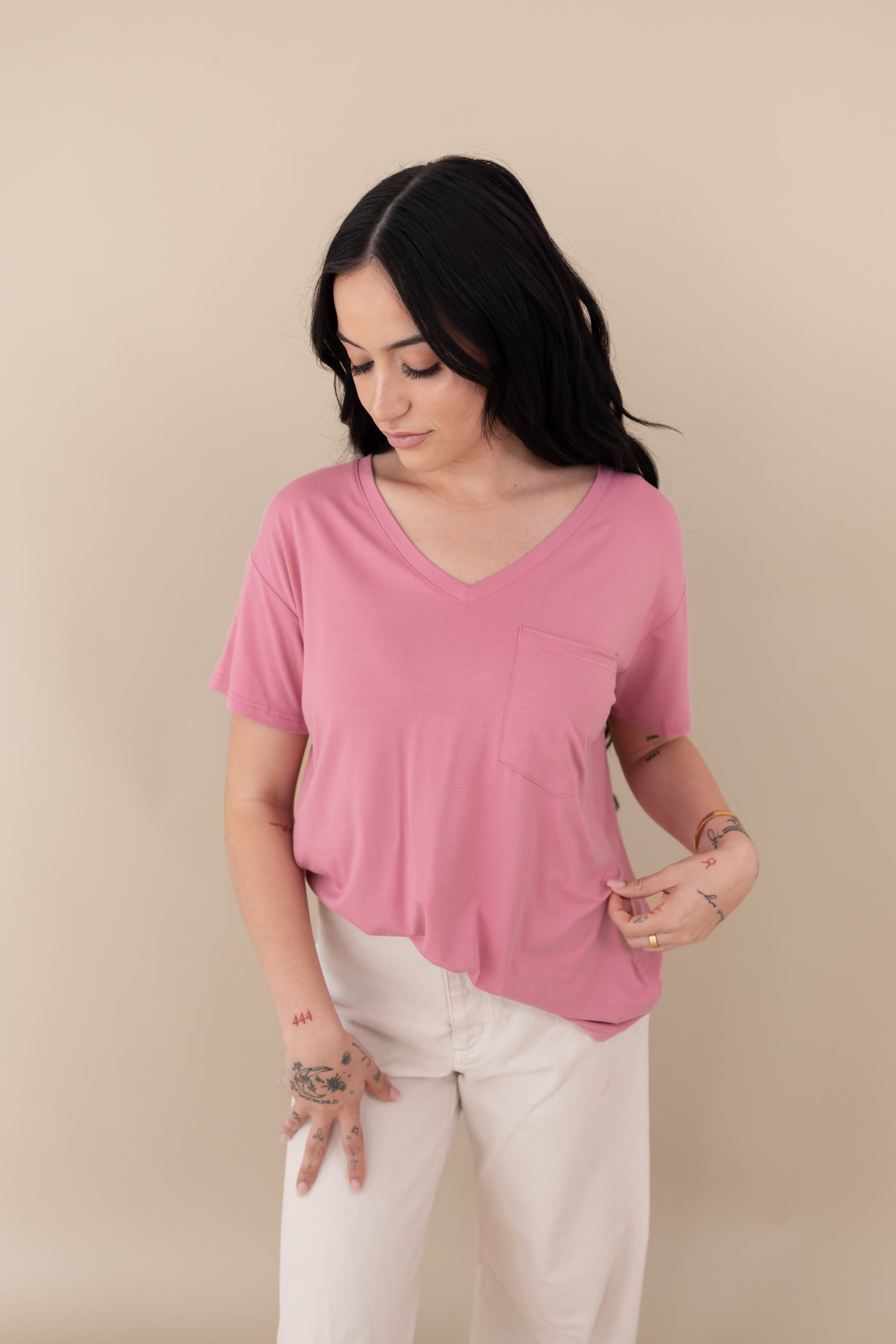 Woman modeling Women’s Relaxed Fit V-Neck in Apple Blossom