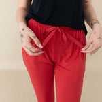Woman modeling Women's Jogger Pants in Cardinal close up of waist tie