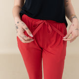 Woman modeling Women's Jogger Pants in Cardinal close up of waist tie