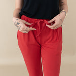 Woman modeling Women's Jogger Pants in Cardinal close up of waist tie