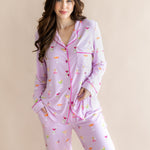Woman with brown hair modeling the Long-Sleeved Women's Pajama Set in Cocktail with her hand in the bottoms pocket
::: Model is 5'7" wearing size S ///
